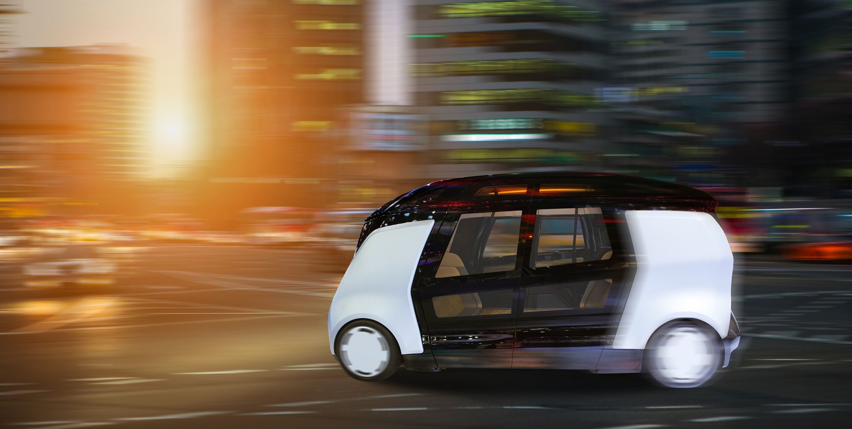 Autonomous vehicle against cityscape background.