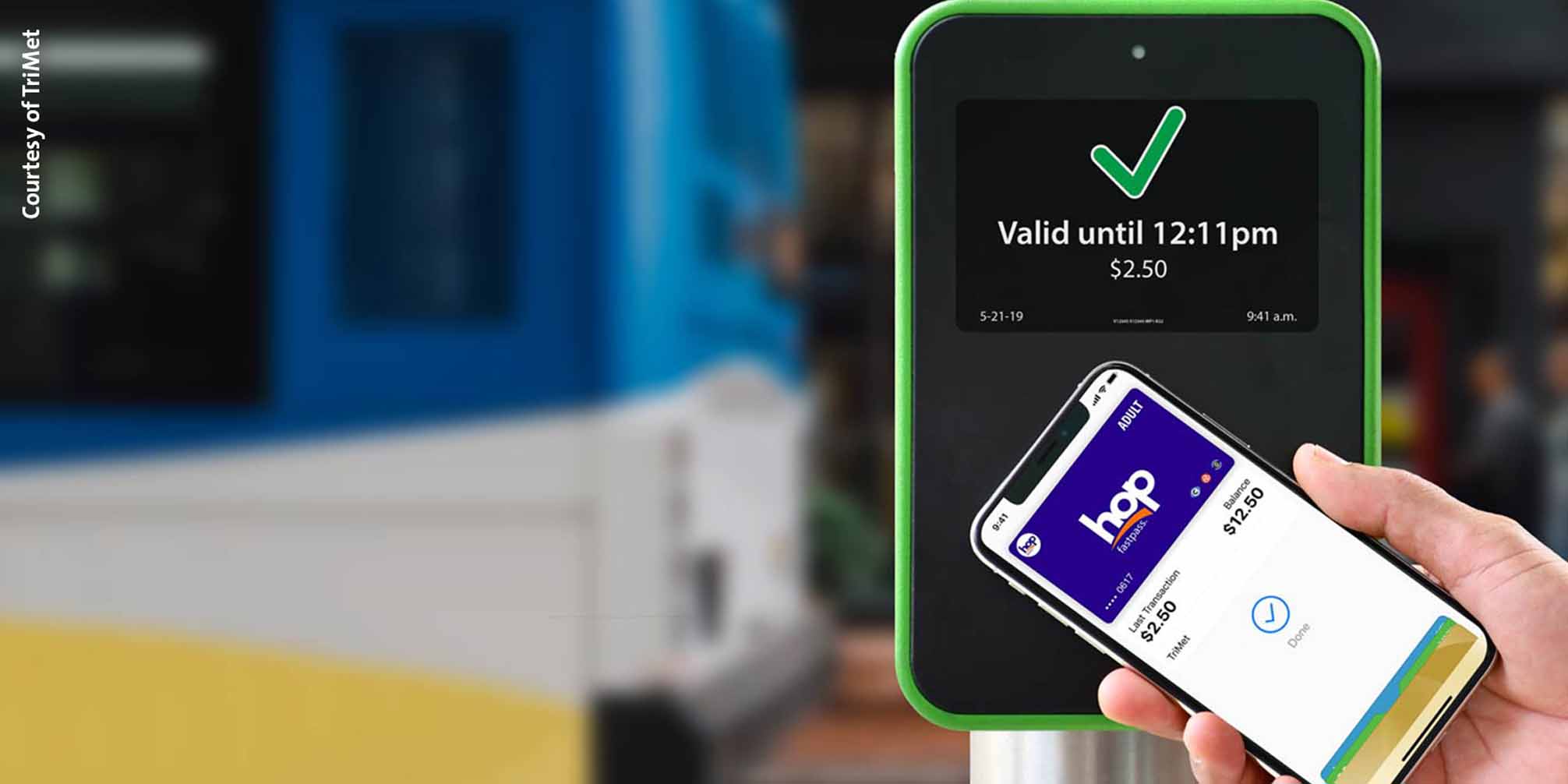 Mobile phone tapping a fare validator.