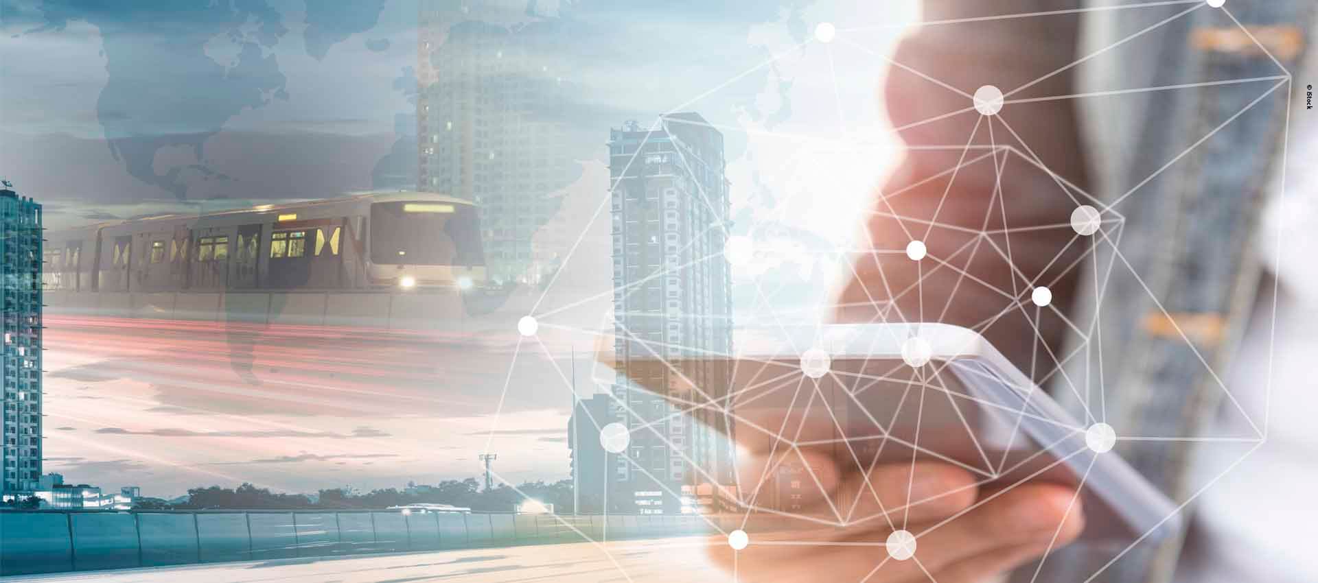 Hand with phone on a background of cityscape and data points. 
