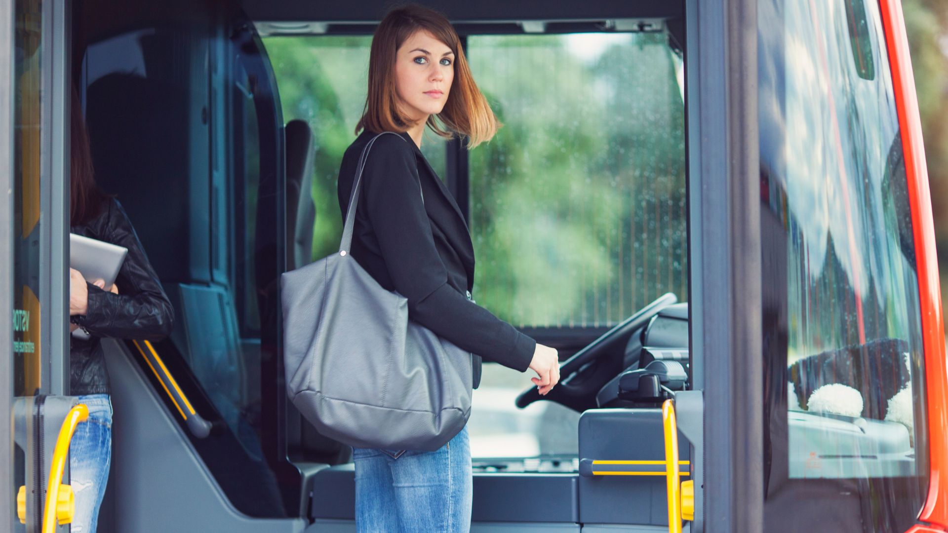 Girl boarding bus, paying fare. 