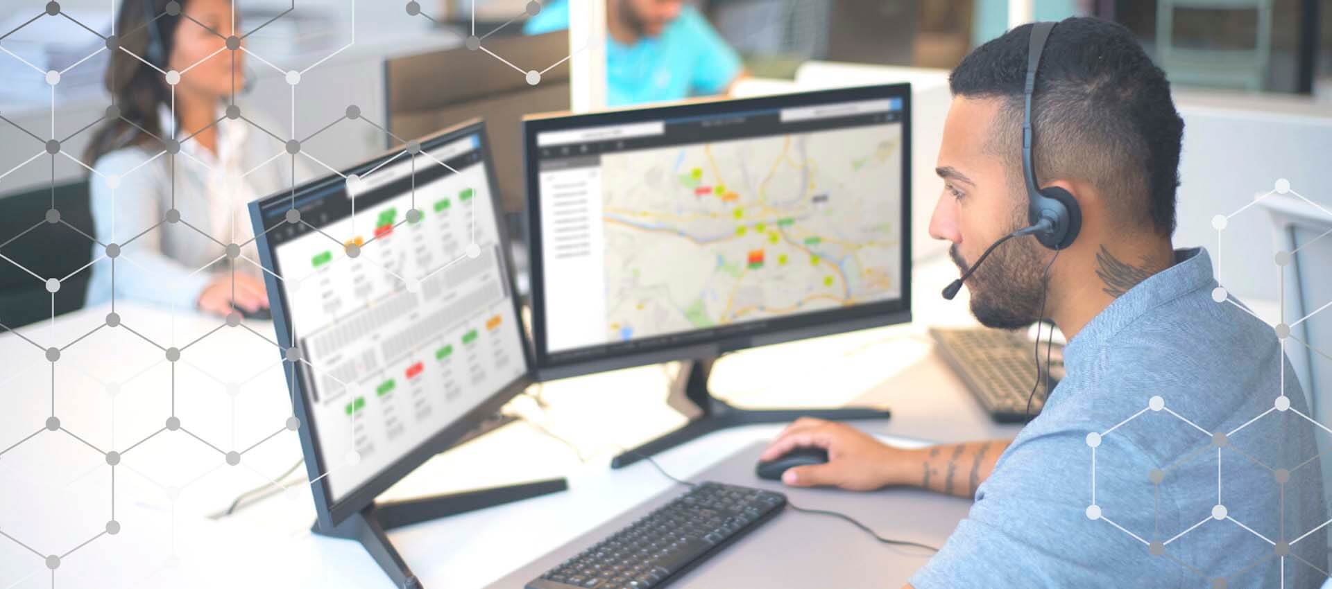 A dispatcher looking at his route display screens.