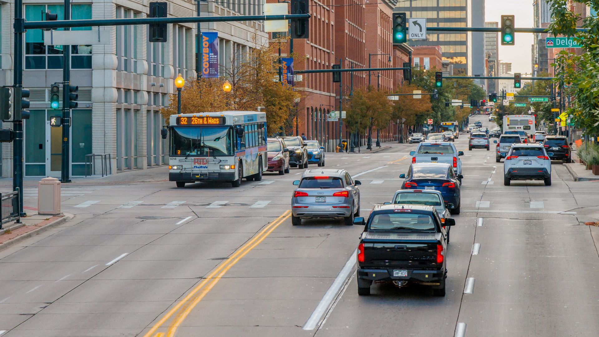 Denver RTD bus approaching a traffic signal. 